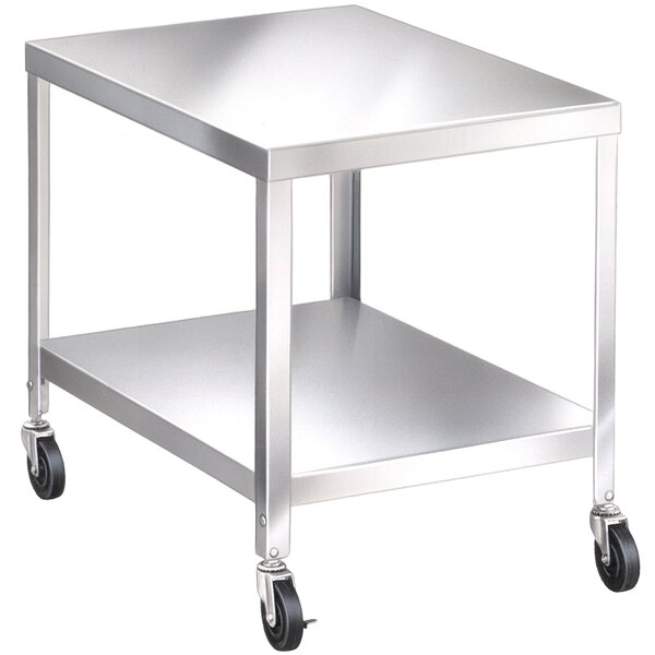 a silver metal table with black wheels