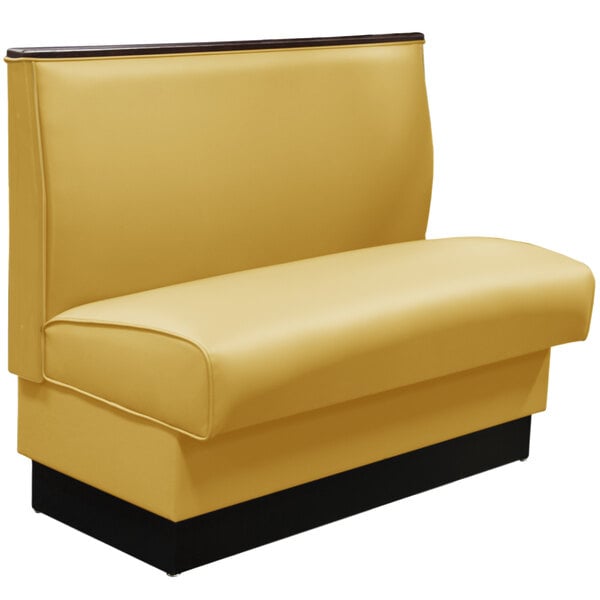 a yellow booth seat with a wooden frame