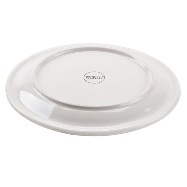 A Libbey narrow rim stoneware plate with brown bands and speckles on it.