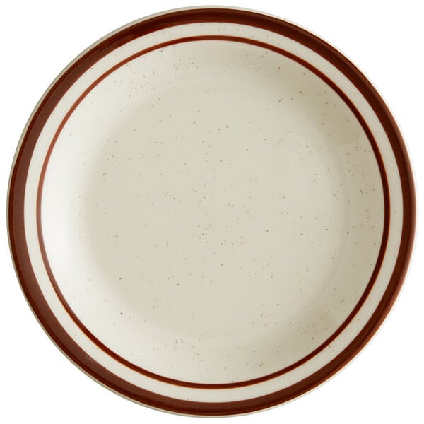 A white Libbey narrow rim stoneware plate with brown speckles and brown bands.