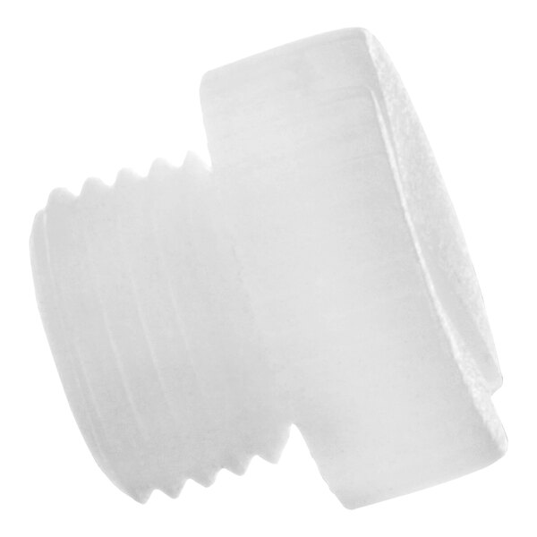 A close-up of a white plastic plug with a screw on it.