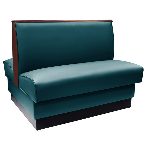 A forest green leather booth with wood end and top caps.