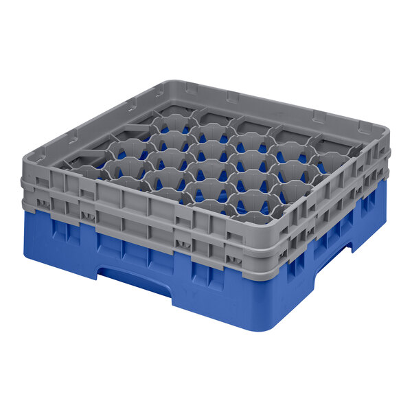 A blue and gray plastic glass rack with 30 compartments for washing and storing glassware.