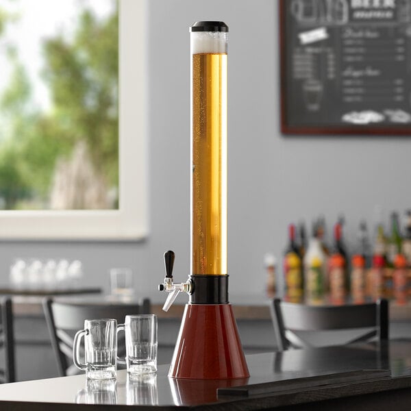 A Beer Tubes woodgrain conic beer tower on a table with glasses of beer.