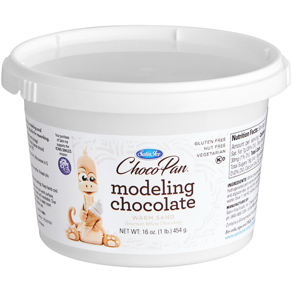 A white Satin Ice ChocoPan tub of warm sand modeling chocolate.