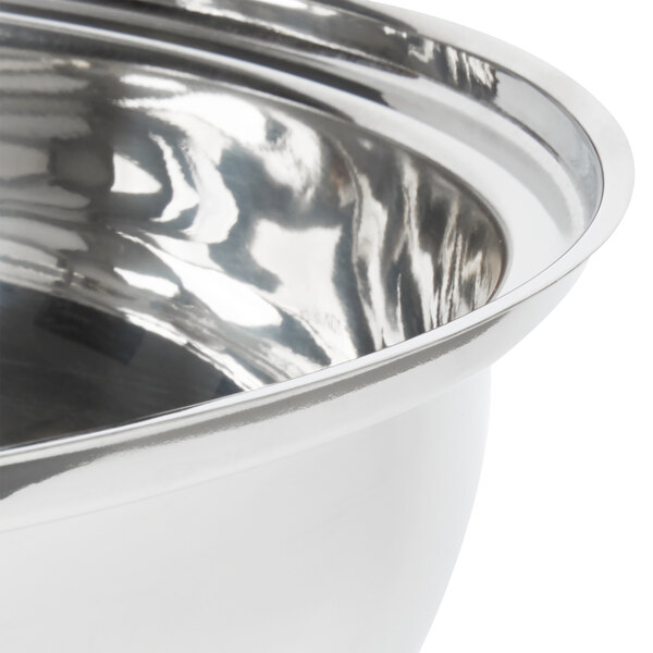 A close-up of a silver stainless steel water pan with a silver rim.