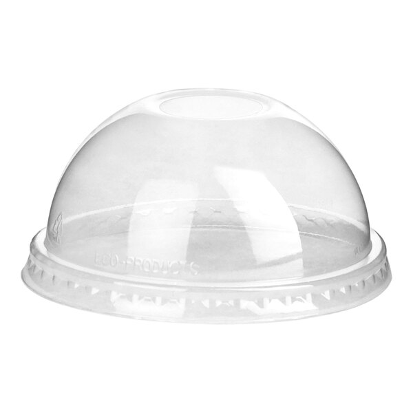 A clear plastic dome lid with a hole on a white surface.