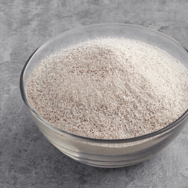 A bowl of UPOURIA Hazelnut Cappuccino Mix on a white surface.