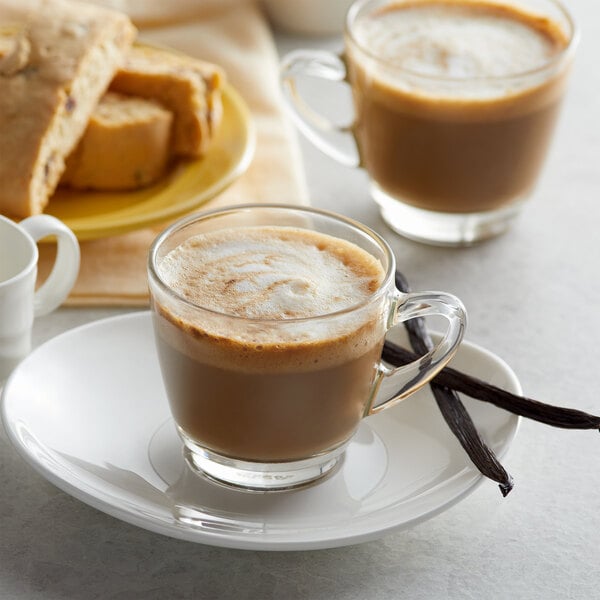 Two lattes on a table at a cafe