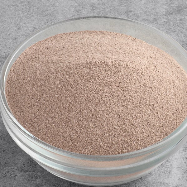 A bowl filled with UPOURIA Black Cherry hot chocolate mix powder.