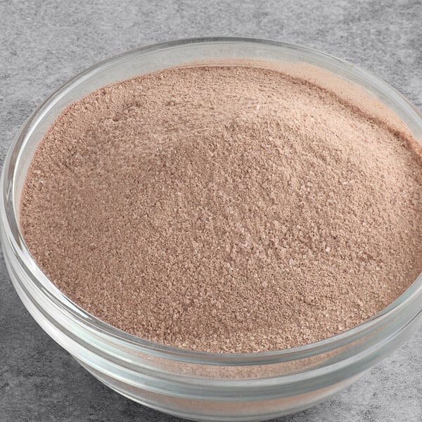 A bowl of UPOURIA gourmet hot chocolate mix powder.