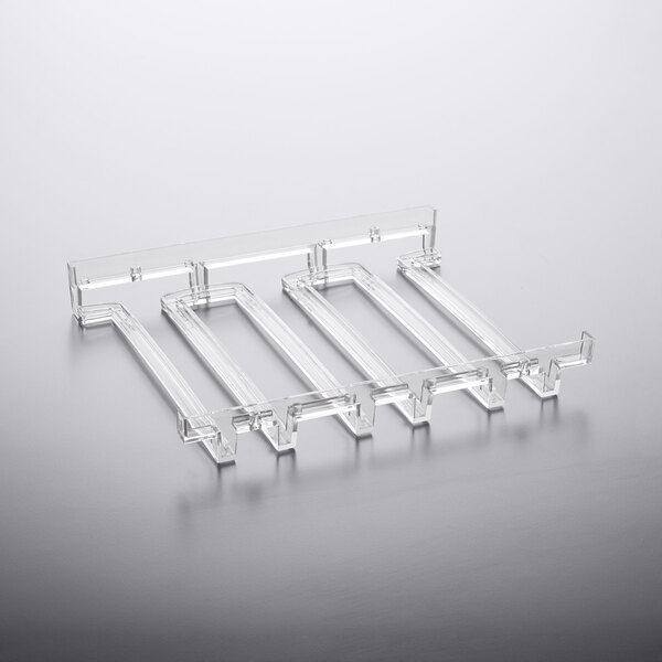 A clear plastic Franmara stemware hanger rack with rectangular slots on a white surface.