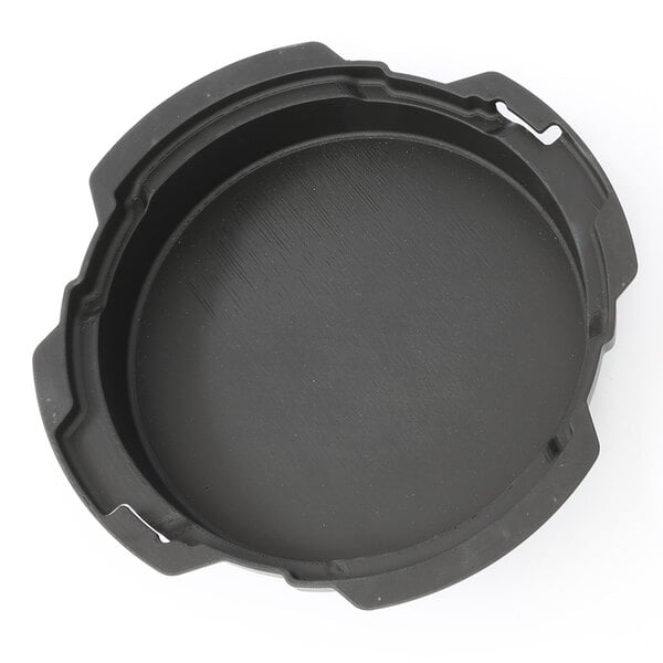 A black plastic round holder with holes.