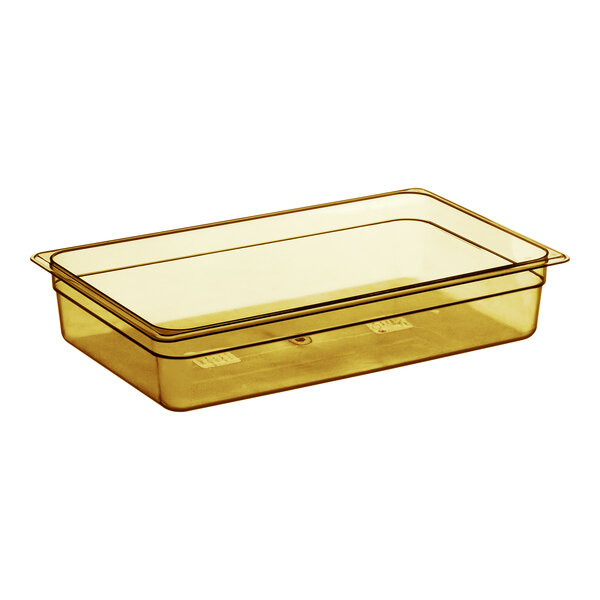 A Cambro amber plastic food pan with lid on a counter.