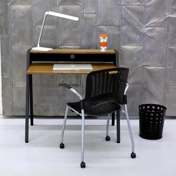 A white LED desk lamp with a multi-pivot adjustable arm and USB port placed on a wooden desk.