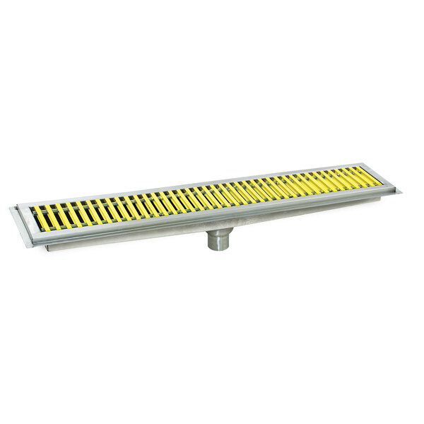 A metal floor trough grate with yellow and black stripes.