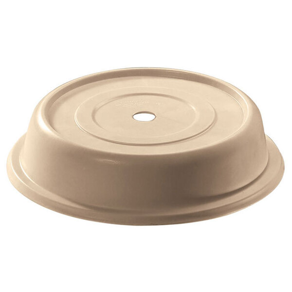 A beige plastic Cambro plate cover with a hole.