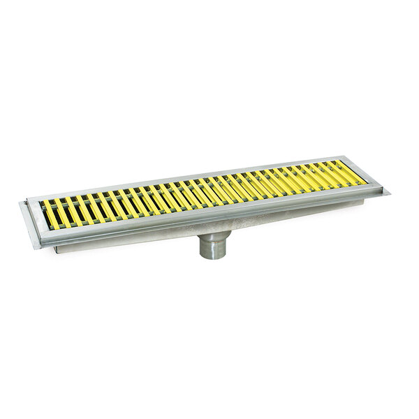 A metal floor trough with yellow fiberglass grating.