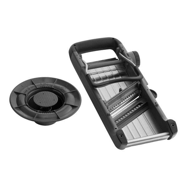 An OXO black and silver Chef's Mandoline Slicer on a counter with a tray.