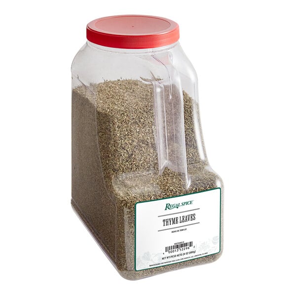 A clear plastic container of Regal Thyme Leaves with a red lid.