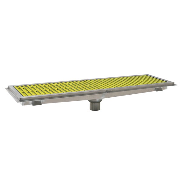 A metal floor trough with yellow fiberglass grating.