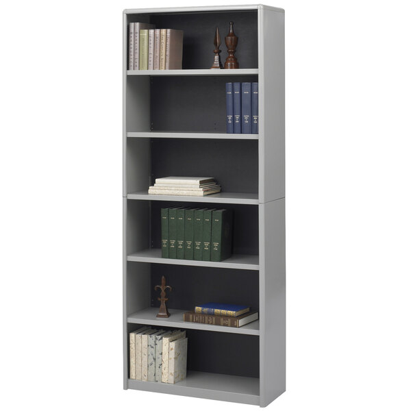 A Safco gray steel bookcase with books on a shelf.