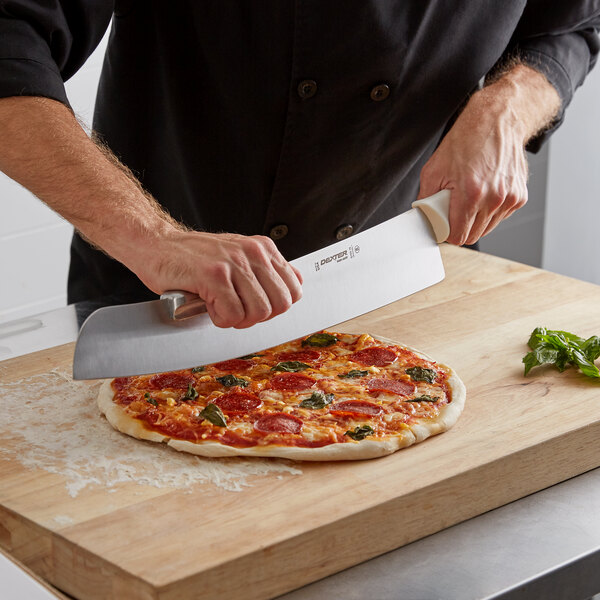 A person using a Dexter-Russell Sani-Safe pizza knife to cut a pizza.