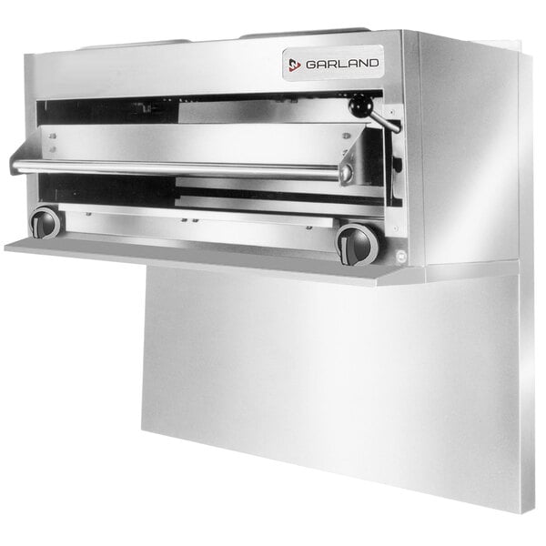 A stainless steel Garland salamander broiler with a door open.