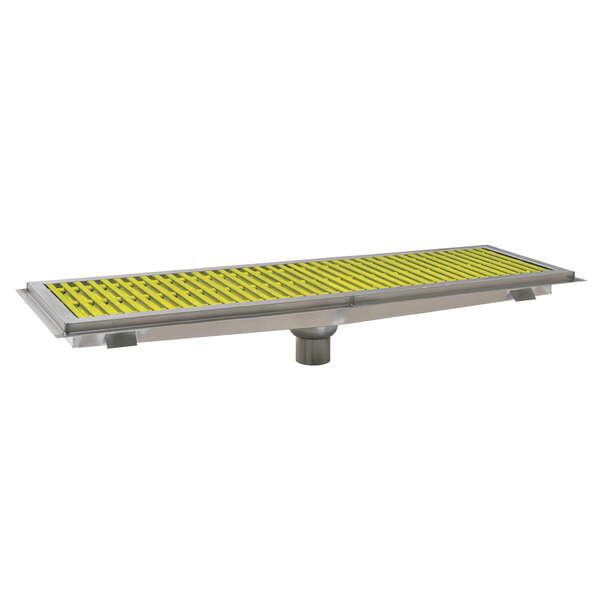 A metal floor trough with yellow fiberglass grating.