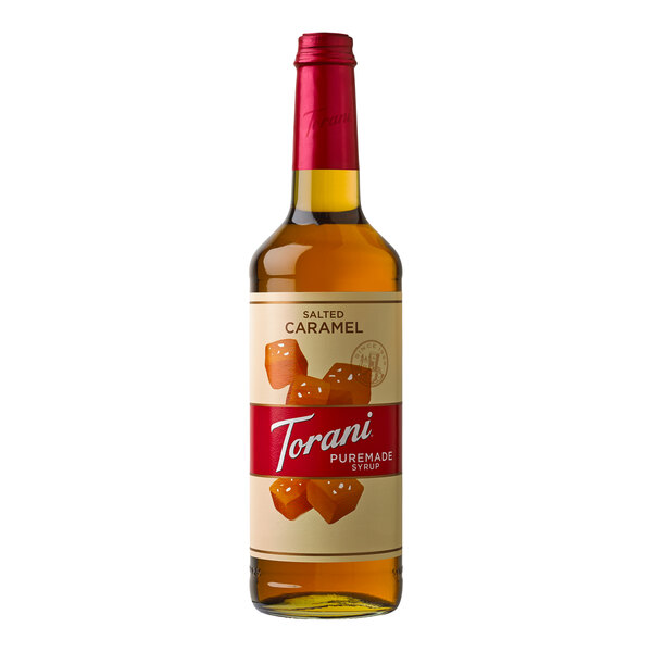 A Torani Puremade Salted Caramel flavoring syrup in a glass bottle with a label.