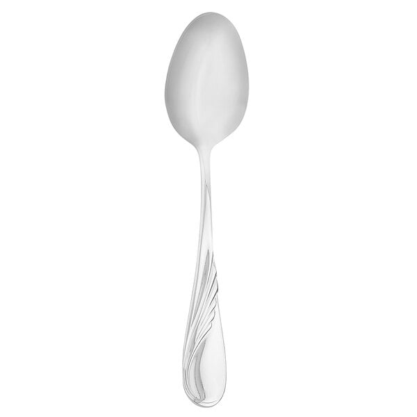 A Walco stainless steel dessert spoon with a curved handle.