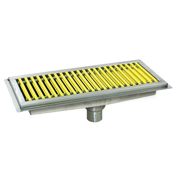 A metal floor trough with yellow fiberglass grating with white stripes.