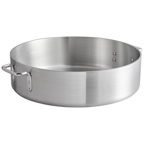 A large silver aluminum brazier with handles.