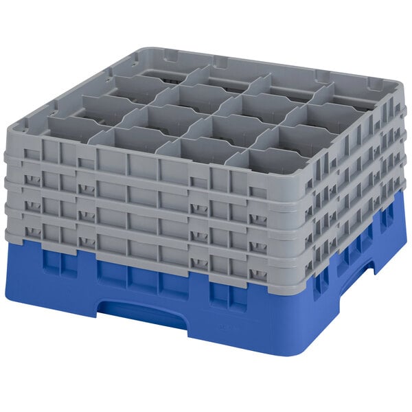 A blue plastic Cambro glass rack with 16 compartments and 4 grey extenders.