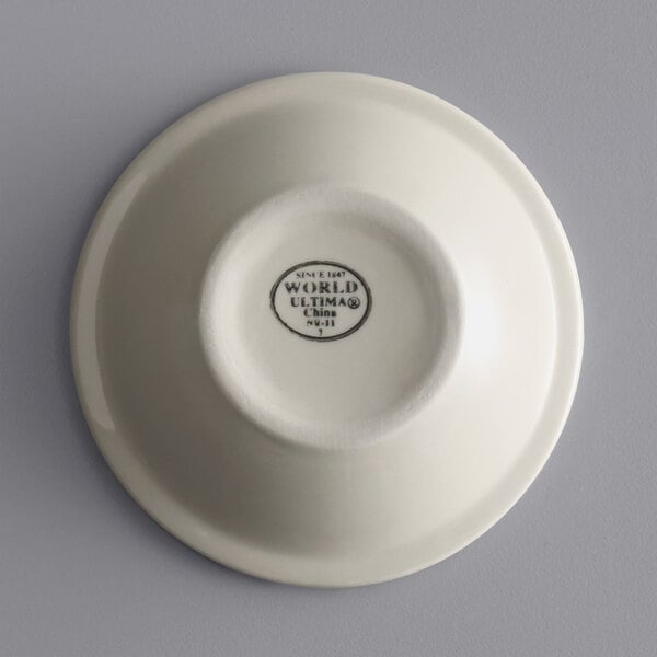 A close up of a white Libbey stoneware bowl with black text on the rim.