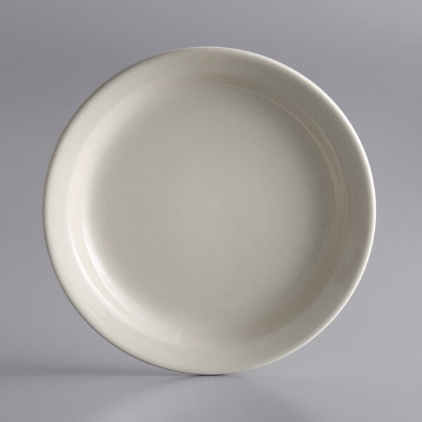 A white Libbey narrow rim stoneware plate on a white background.