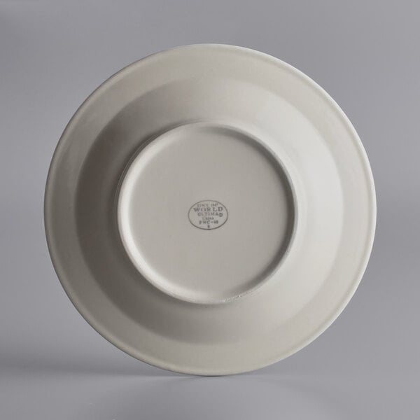 A close-up of a Libbey stoneware pasta bowl with a small rim and a logo on it.