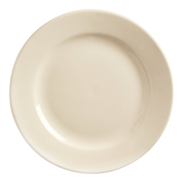 A cream white round stoneware plate with a rolled edge.