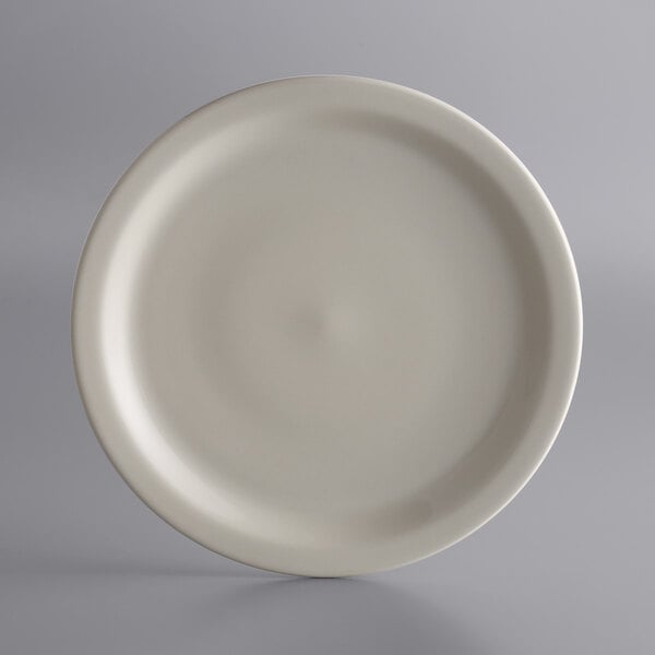 A white Libbey stoneware plate with a narrow rim.