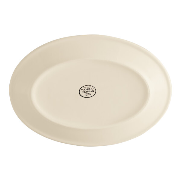 A cream white oval stoneware platter with a rolled edge.