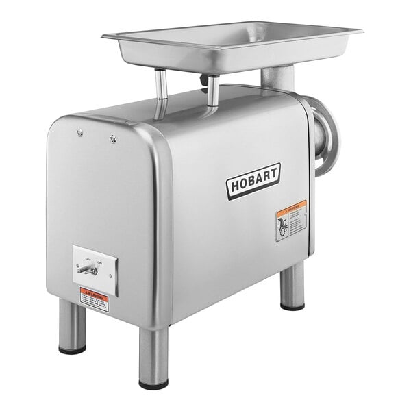 A silver Hobart meat grinder with a metal tray.