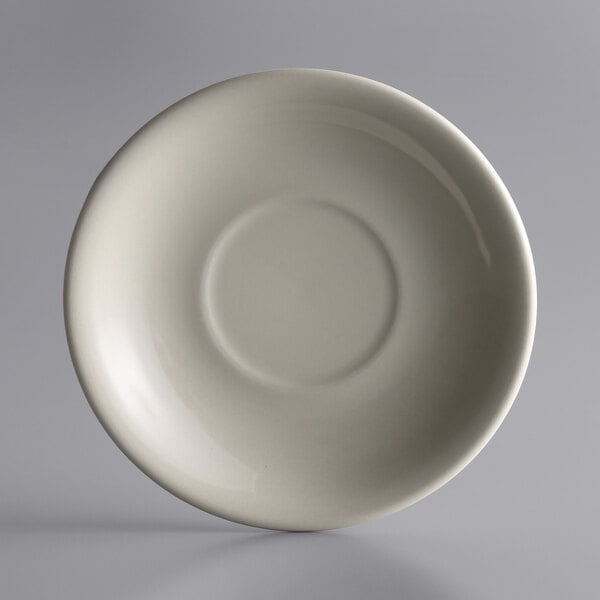 A white Libbey stoneware saucer with a flat surface and a small rim.