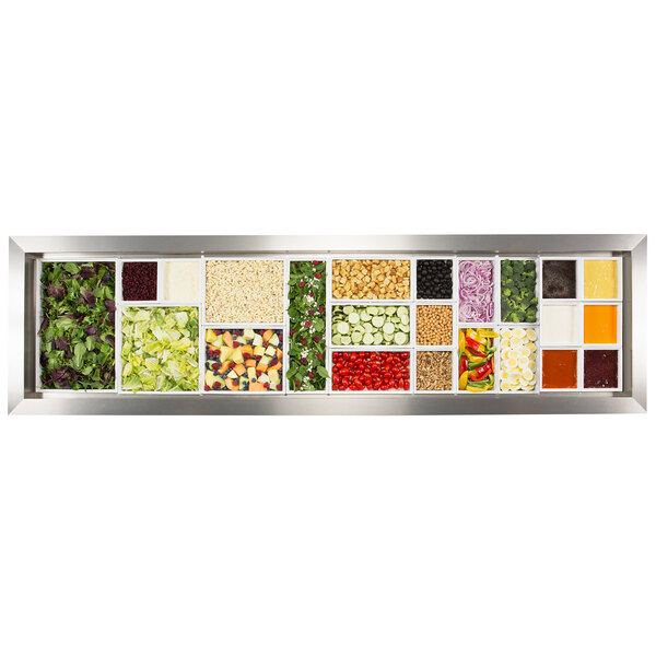 A rectangular box with a Bon Chef EZ Fit Smart Bowl Filler Package for three pan well filled with a variety of vegetables and fruits.