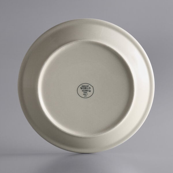 A white Libbey narrow rim stoneware plate with a logo on it.