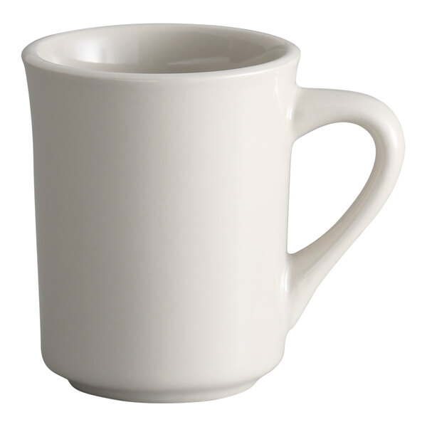 A plain white stoneware mug with a rolled edge and a handle.