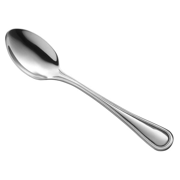 A Libbey stainless steel dessert spoon with a silver handle.
