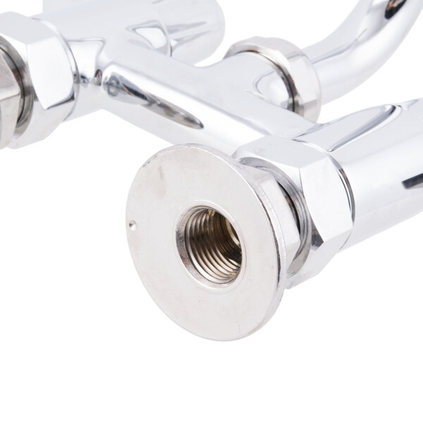 A close-up of a chrome deck-mounted Equip by T&S faucet with two lever handles.