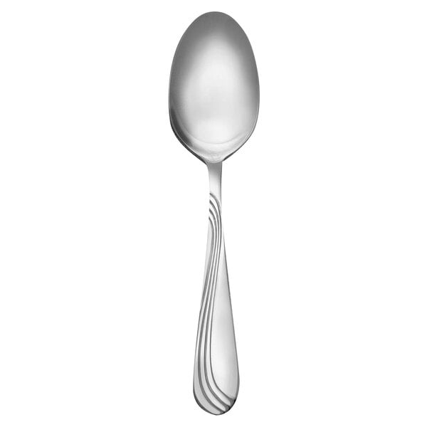 A Libbey stainless steel teaspoon with a curved handle.