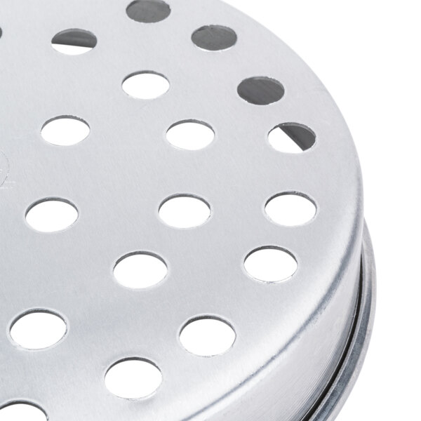 An American Metalcraft aluminum pizza pan with perforations on the surface.