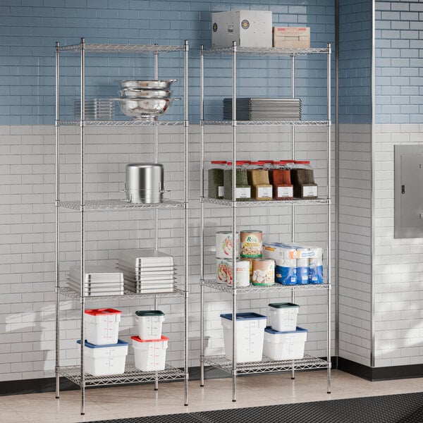 Regency chrome wire shelving in a school kitchen with food items on the shelves.